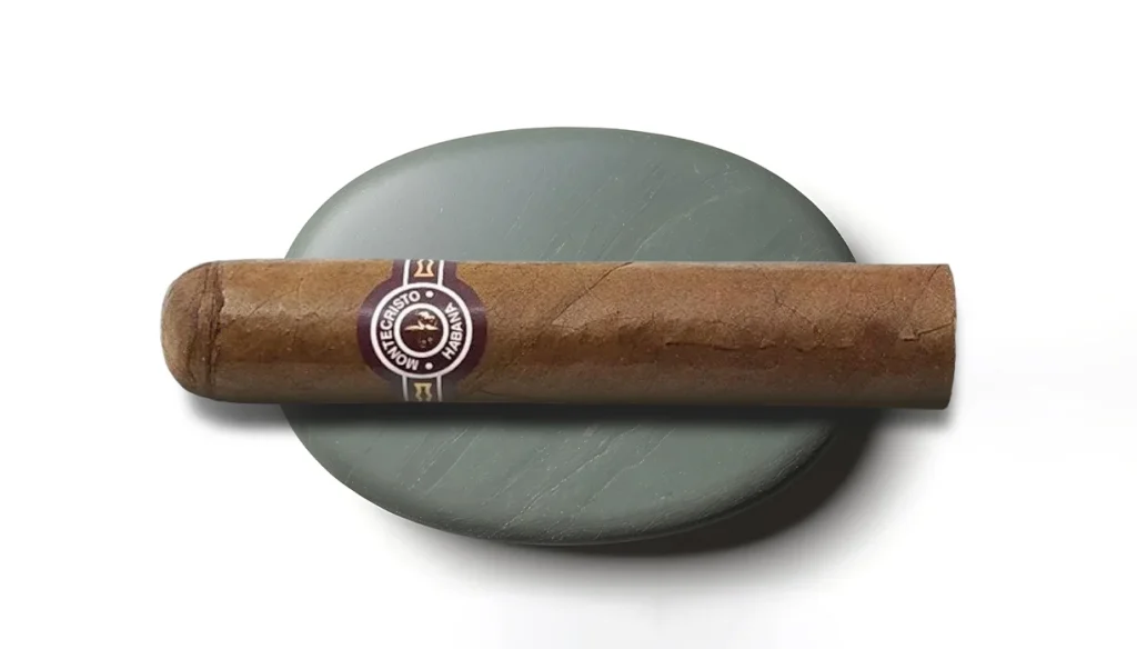 A Montecristo cigar — one of the most celebrated Cuban brands, prized for its smooth, complex draw and timeless appeal
