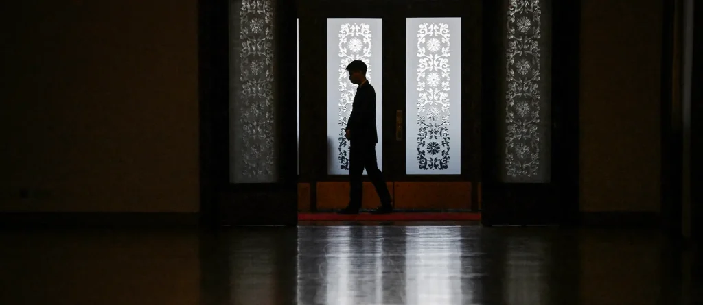 Is Shen Yun Cult? CCP Propaganda vs. Real Allegations in 2026 3 A security guard stands outside a meeting room at the Great Hall of the People in Beijing on March 6, 2024.