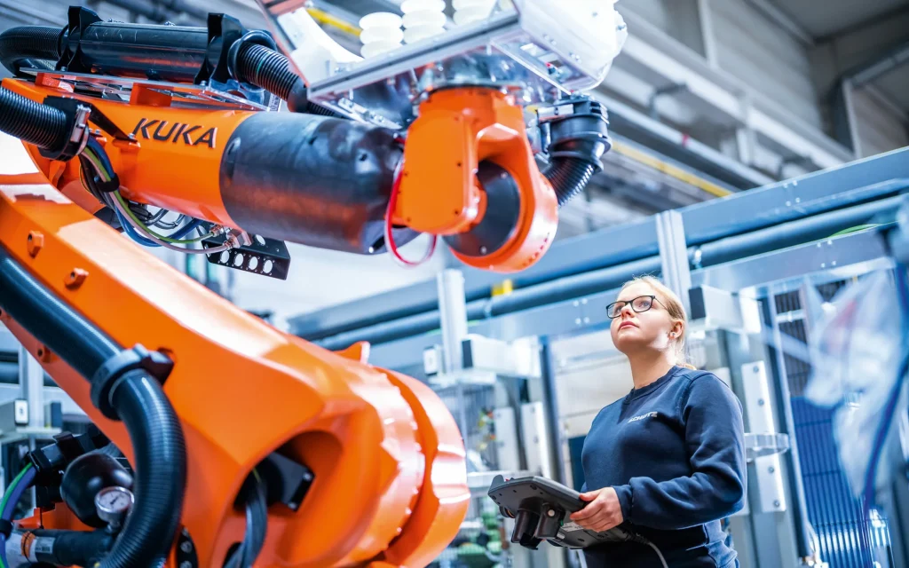 German precision manufacturing workers on a factory floor — mechanical engineering is the sector most affected by China's acquisition of German-developed patents